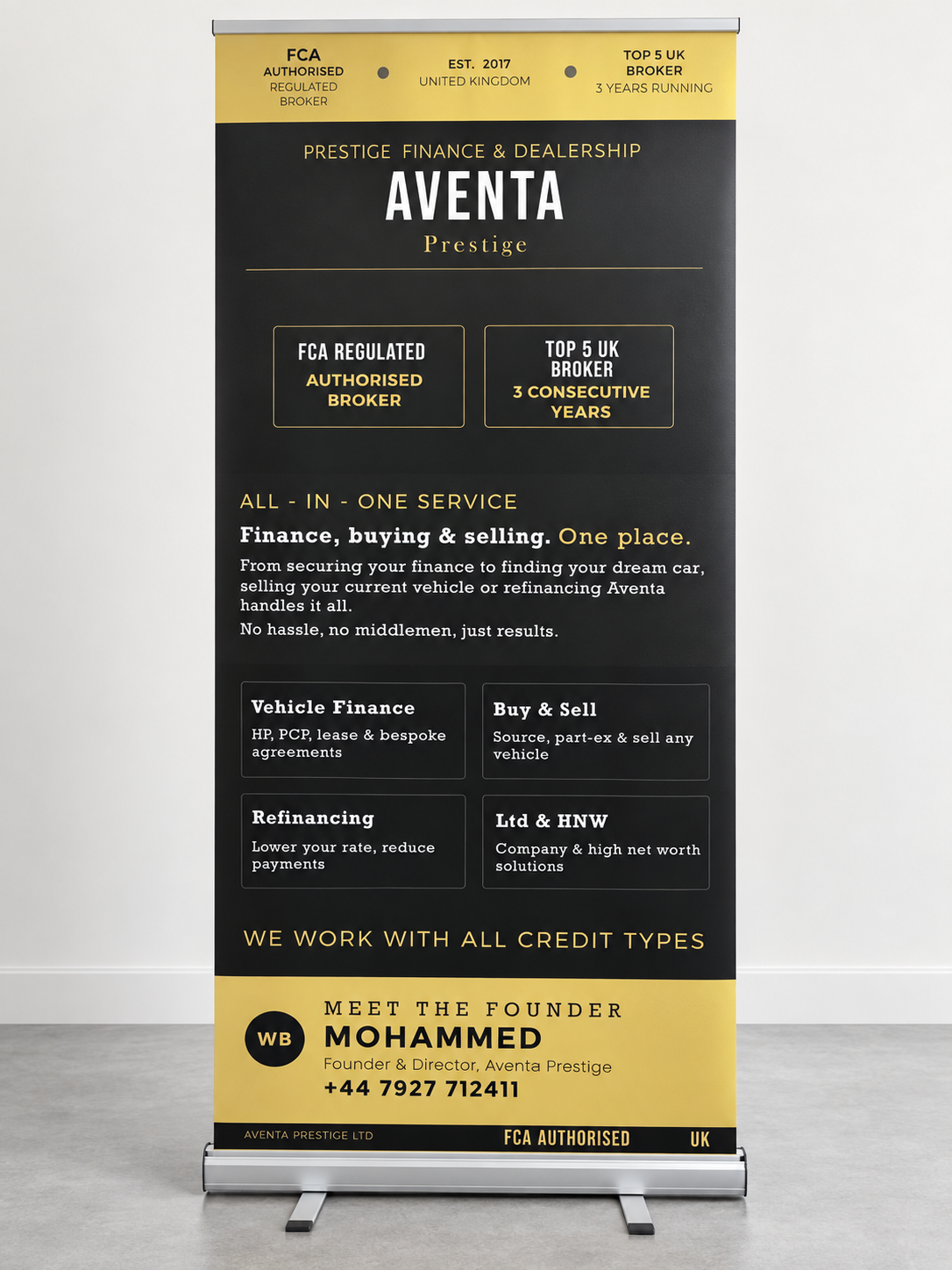 Black and gold Aventa Prestige roller banner on a silver stand