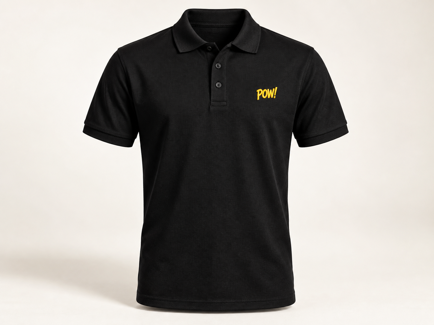 Black polo shirt with a yellow embroidered chest logo