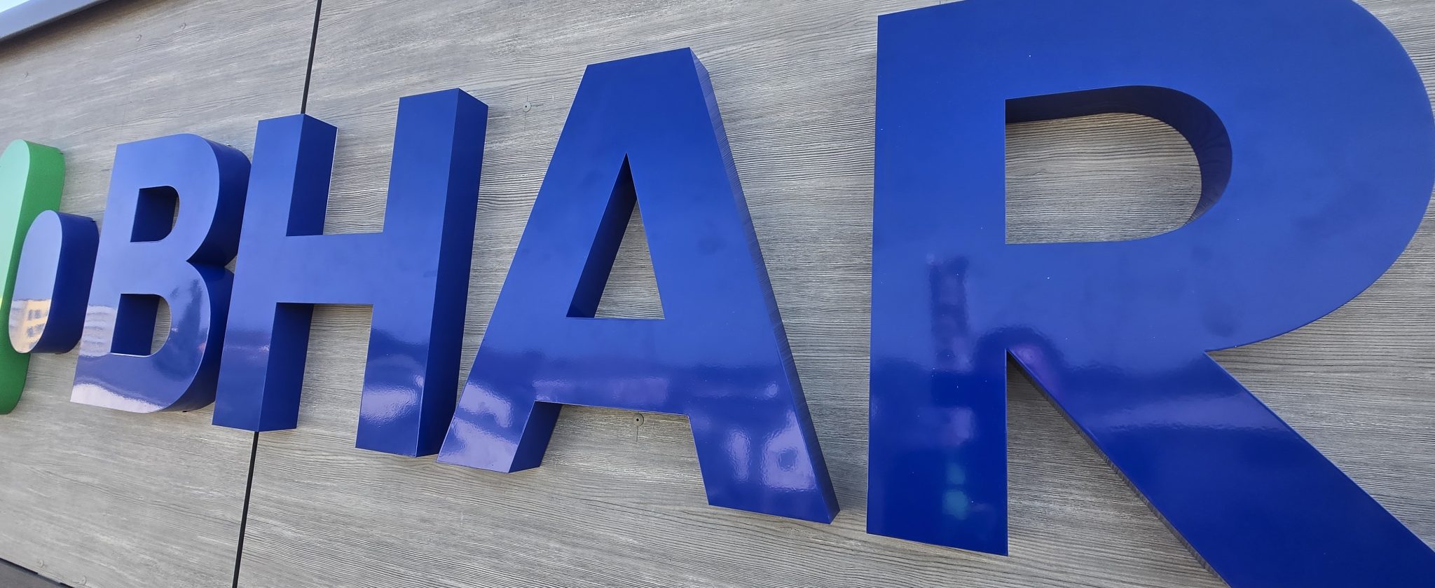 Blue built-up stainless steel lettering on Bharani Health Hub in Slough