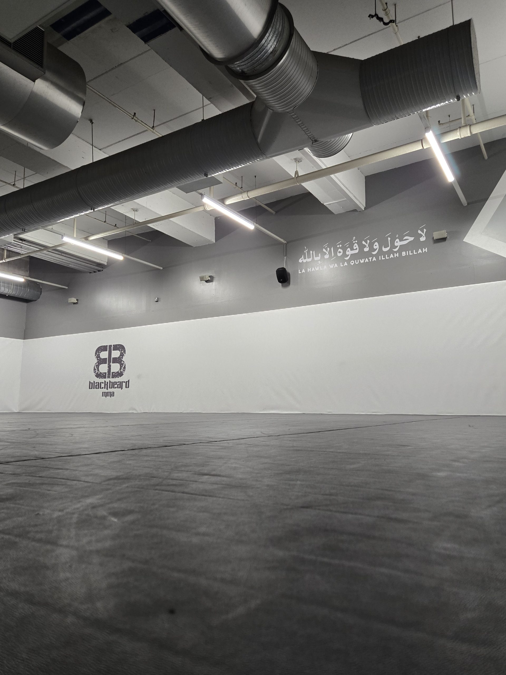 Blackbeard Academy branded wall graphics inside the Slough training space